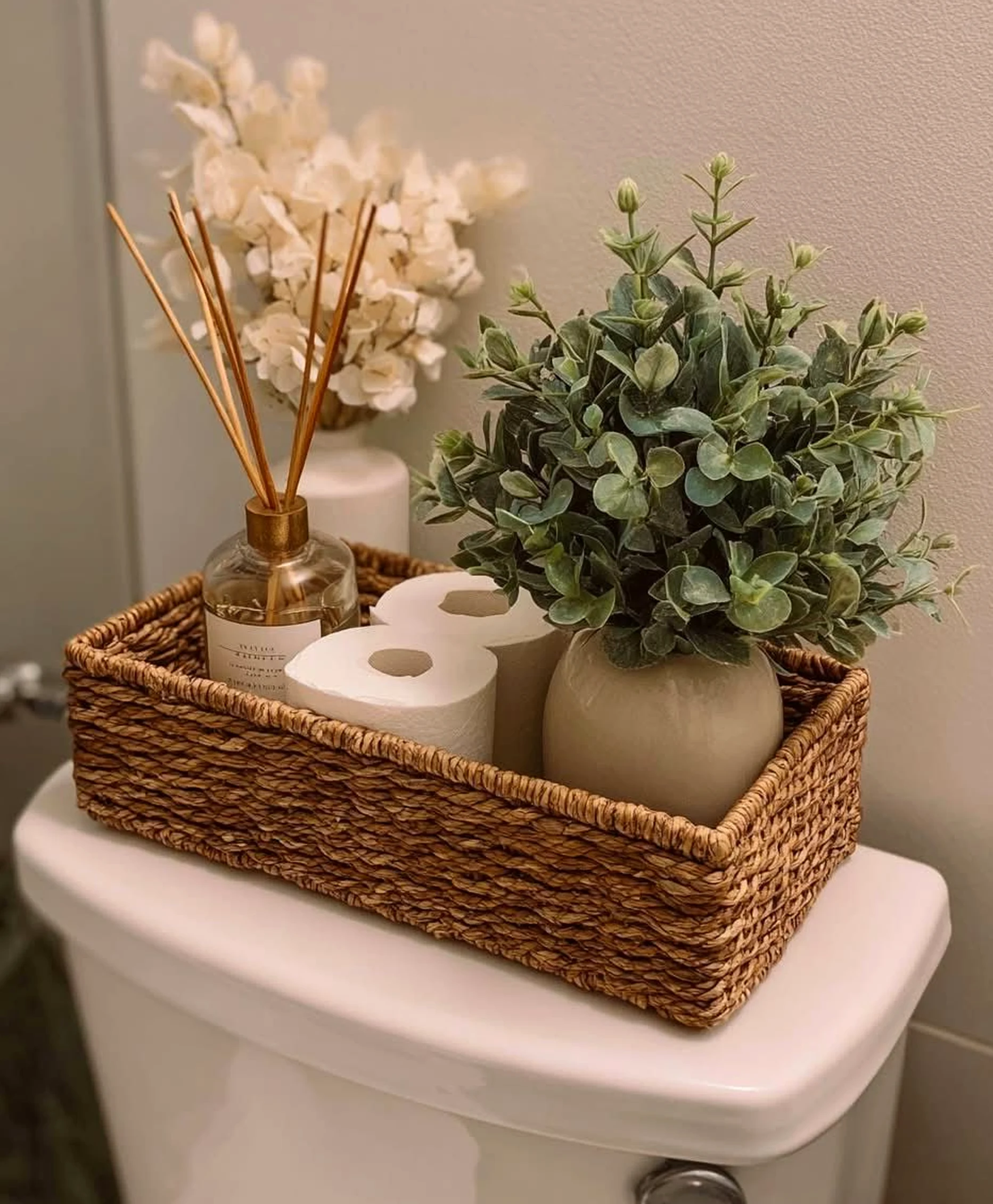 Natural bedside layer supports the table through shape, leaving the space feeling fresh and intentional.