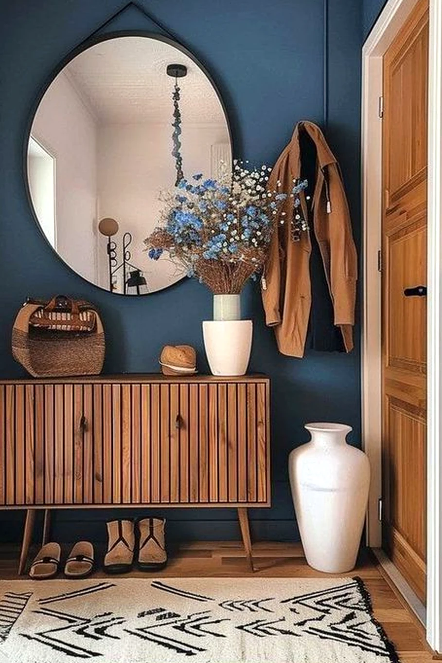 Sculptural shower wall frames the design with depth, making the scene feel warm without clutter.