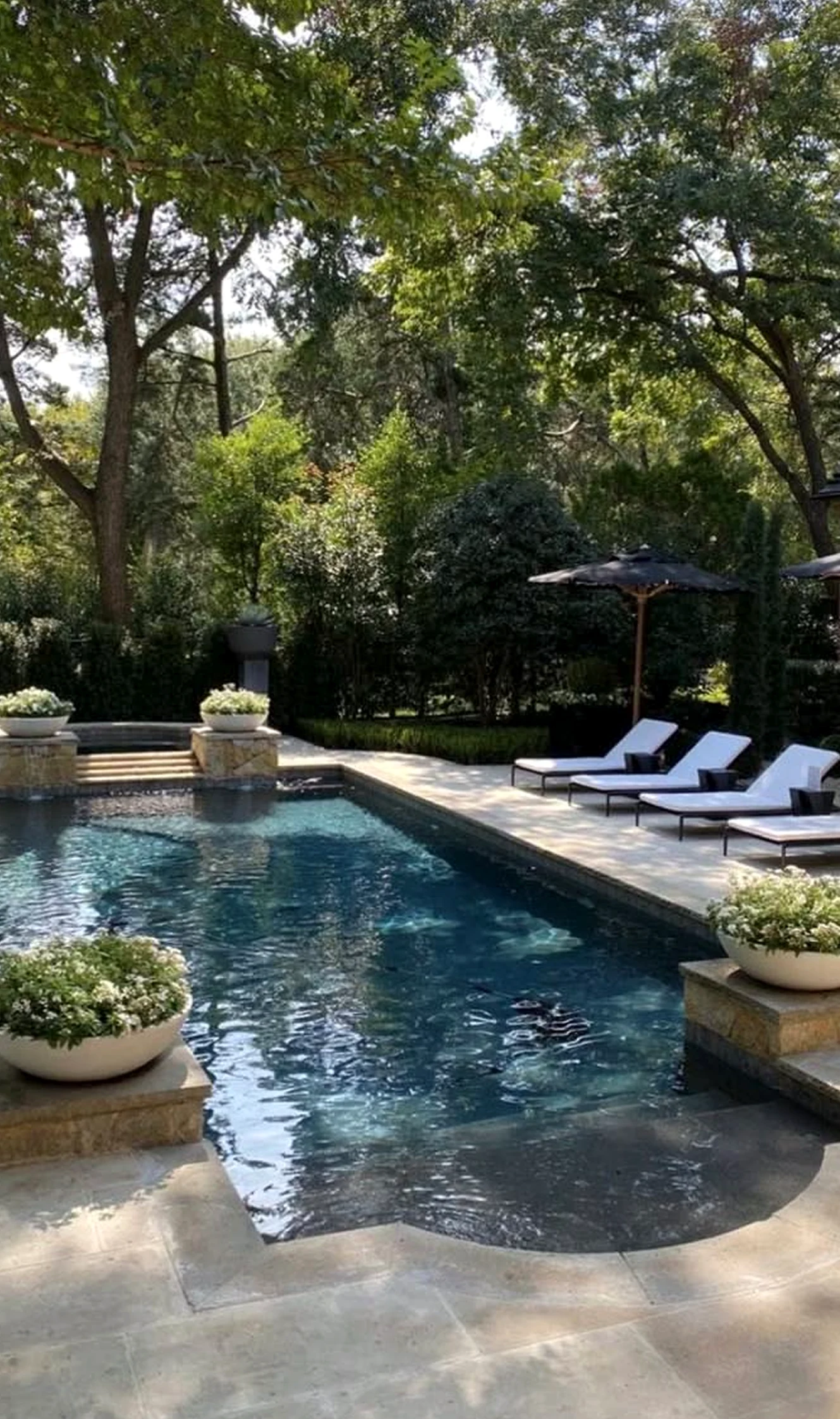 Subtle poolside setting brings a useful note of movement, making the corner feel pleasantly composed.