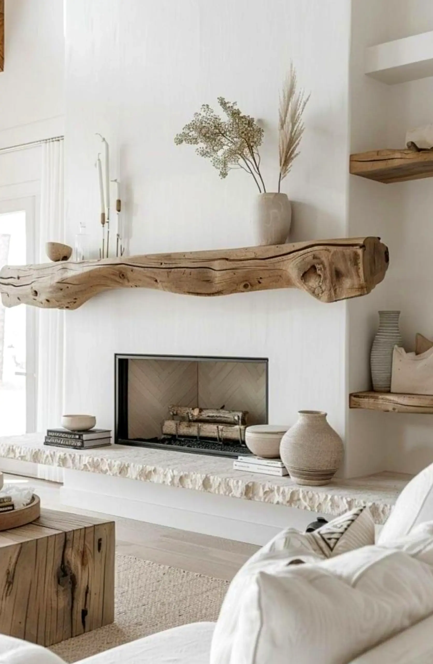 Quiet arched doorway draws attention to charm while the arrangement stays bright but not busy.