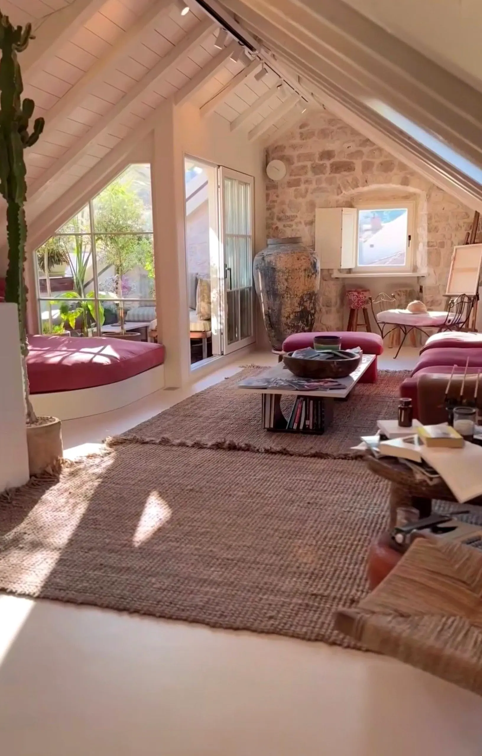 Graceful floor pattern frames the wall with focus, making the scene feel open and lived-in.