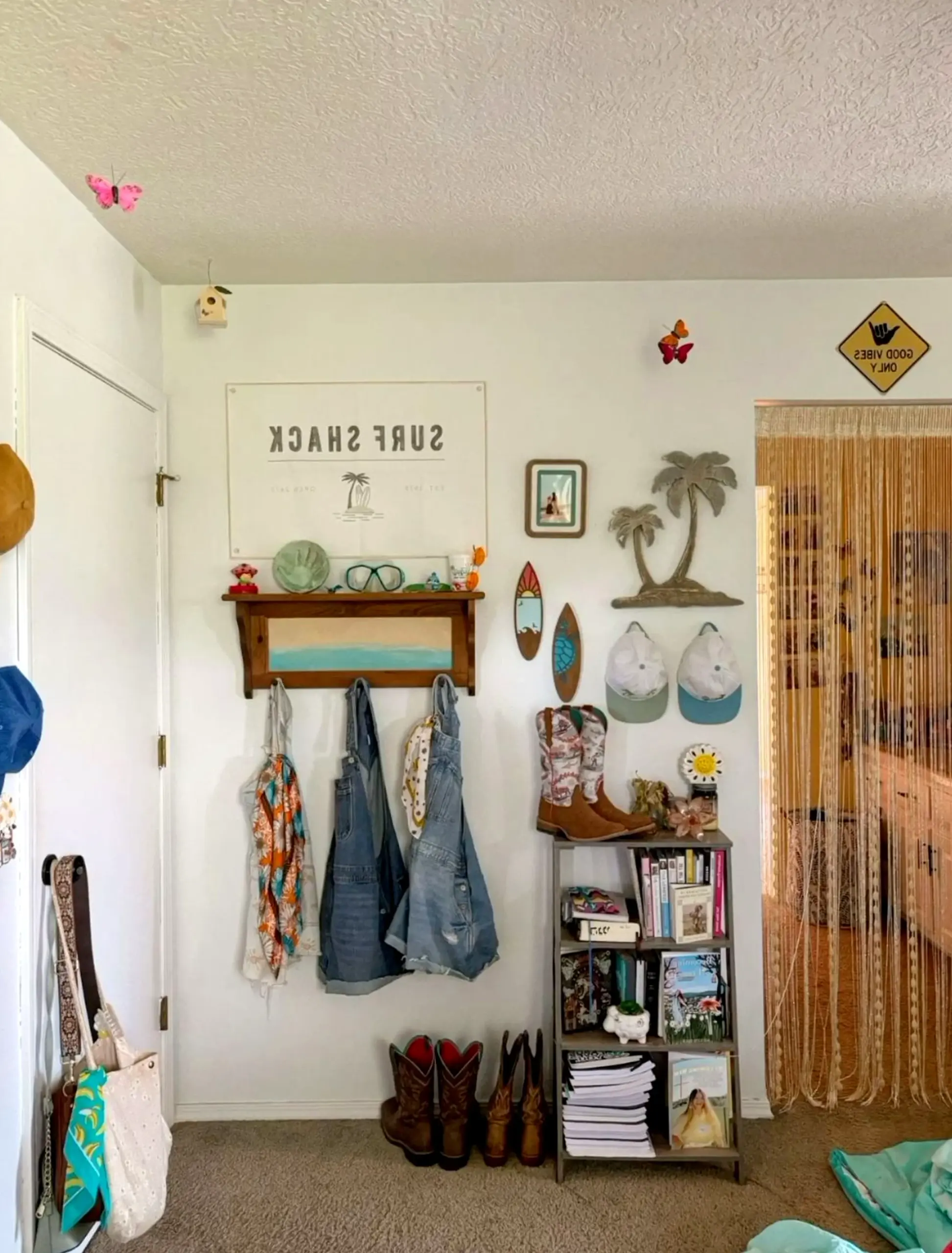 Textured storage corner adds warmth across the entry, giving the decor a finish that feels easy to enjoy.