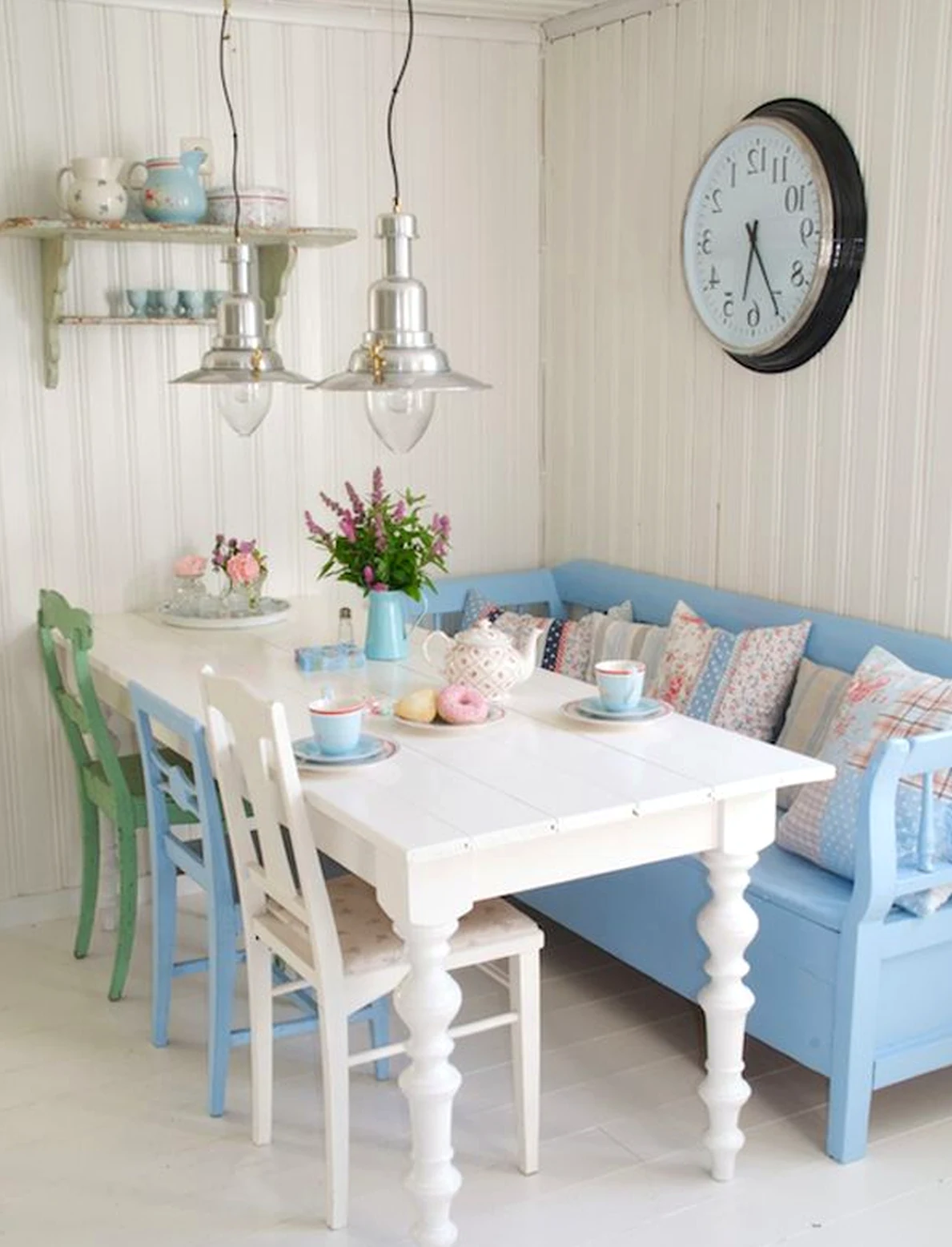 Inviting kitchen nook anchors the corner with contrast, giving the view a mood that feels visually grounded.